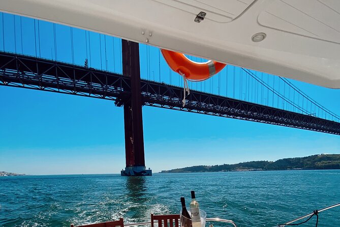 2H Lisbon Private Luxury Catamaran Tour with Welcome Drink - Historic Riverfront Views: Small Windows That Add Up