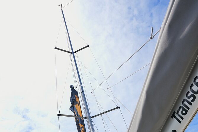 4 Hours Private Swimming/Sailing Tour on Sailboat in Lisbon Beach - Sailing under Lisbon icons: the 25 de Abril Bridge from close range