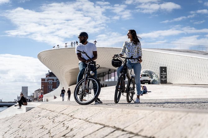 Belém E-Bike Guided Tour Explore Lisbon by the river - Ribeira das Naus and the calm between docks and river steps