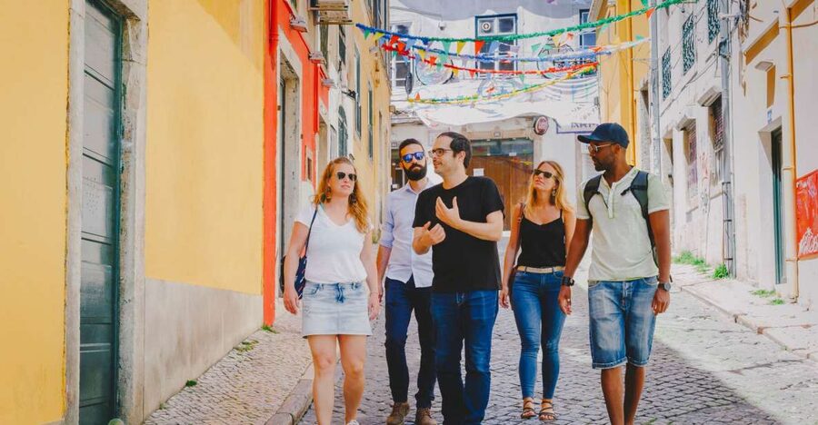 Best of Lisbon Walking Tour: Rossio, Chiado & Alfama - Rossio Railway Station to Restauradores Square: History in the Middle of Traffic