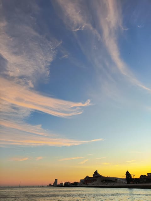 ⛵Bluemotion Lisbon⛵: Sunset sailing tour in Tagus River - Praça do Comércio to Alfama: Lisbon’s Riverfront in Motion
