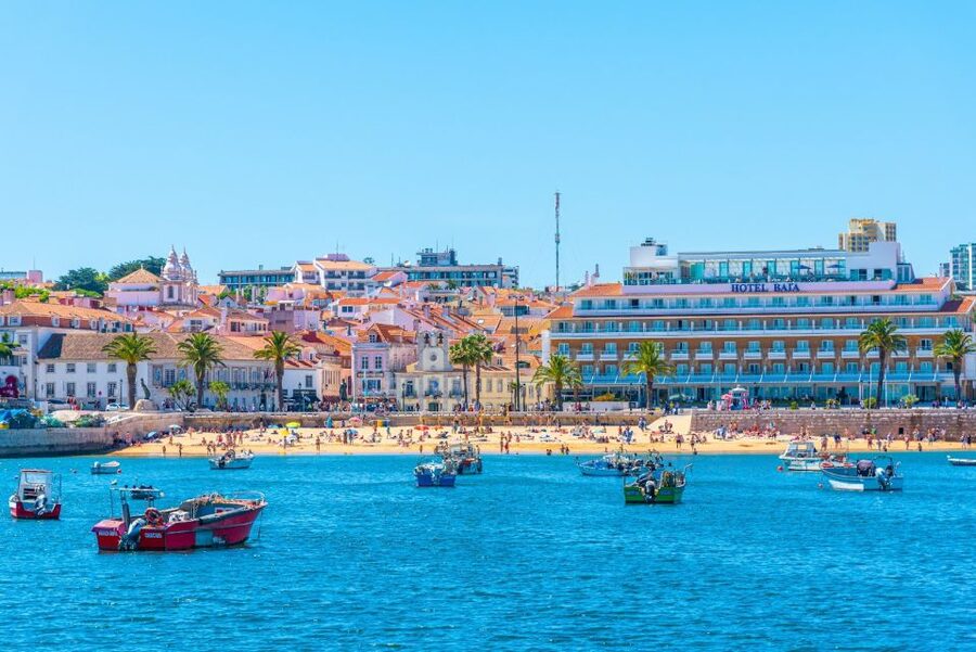 Cascais: City, Cabo da Roca, and Sintra Tuk-Tuk Tour - Praia do Guincho: kitesurfers and that strong Atlantic wind