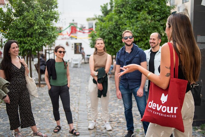Devour Lisbon Food & Fado Tour Mouraria & Alfama Neighbourhoods - Live fado performance with included tickets: how context changes the show
