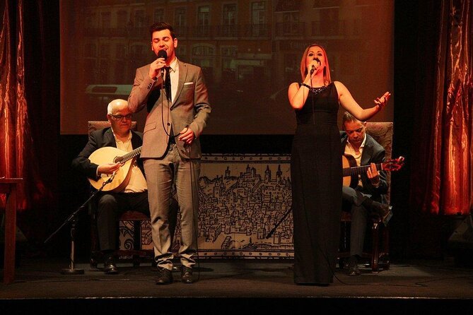 Fado in Chiado - Live Show in Lisbon on Stage for over 15 Years - The Stage Setup: Two Singers, Two Guitars, and Lisbon on Screen