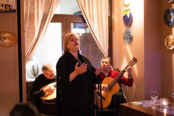 Fado Musical Experience with Portuguese Wine & Appetizers - Finding the right starting point: the yellow umbrella and a 3-minute hop