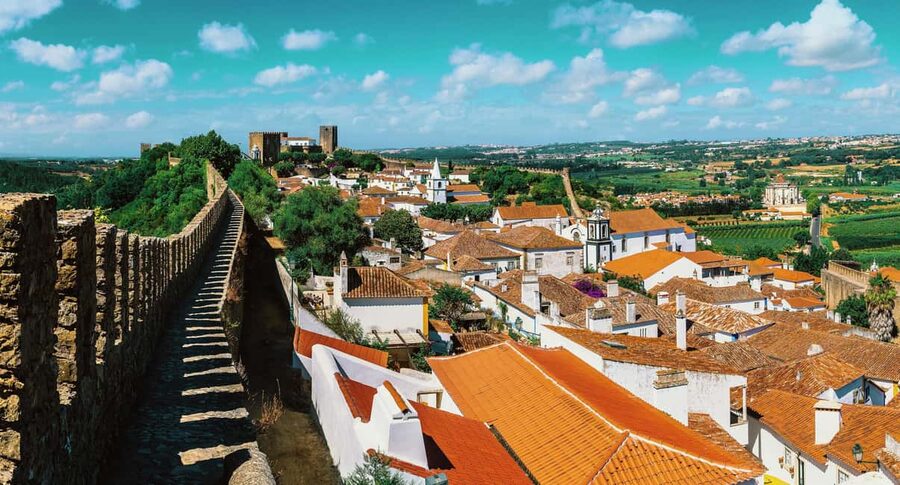 From Lisbon: Nazare Big Waves & Óbidos Small Group Tour - Nazaré Up Close: Lighthouse Views and the Big-Wave Reality