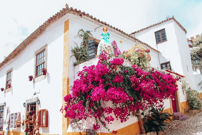 From Lisbon : Óbidos & Nazaré Giant Waves, Ginja & Small Group - Óbidos Village walking time: walls, colors, and the ginjinha moment
