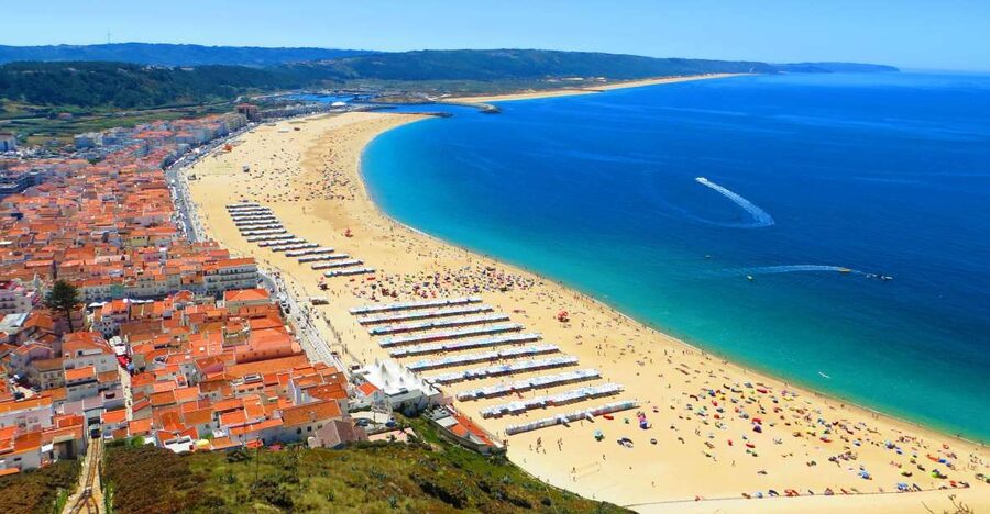 From Lisbon: Private Transfer to Porto with City Stops - Nazaré: ocean views, beach time, and the surfer-town feel