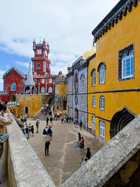 From Lisbon: Sintra, Pena, Regaleira, Peninha, & Coastline - Lunch away from the tourist press