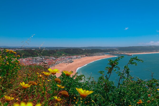 From Lisbon: Small Group to Pena Palace, Nazaré & Fátima - A 9-hour triple-destination day from Lisbon