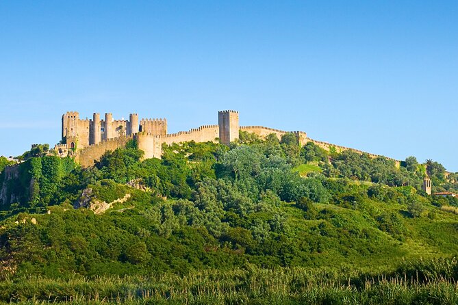 From Lisbon : Tour Óbidos & Nazaré - Medieval Villa and Giant Waves - Óbidos Village on Rua Direita: Craft Shops, Street Charm, and Ginjinha