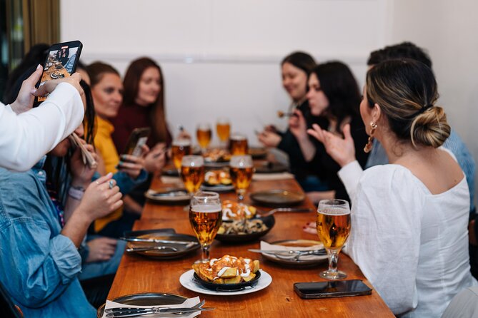 Lisbon: Award-Winning Guided Walking Food Tour with Local Drinks - Rua da Vitória: Grilled Sardines and Vinho Verde Crispness