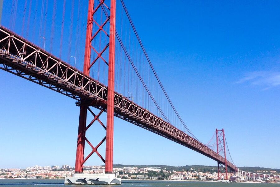 Lisbon: Boat Tour Ticket and Hop-on Hop-off 48-Hour Bus. - The Yellow Boat on the Tagus: 25th April Bridge and hilltop backdrops