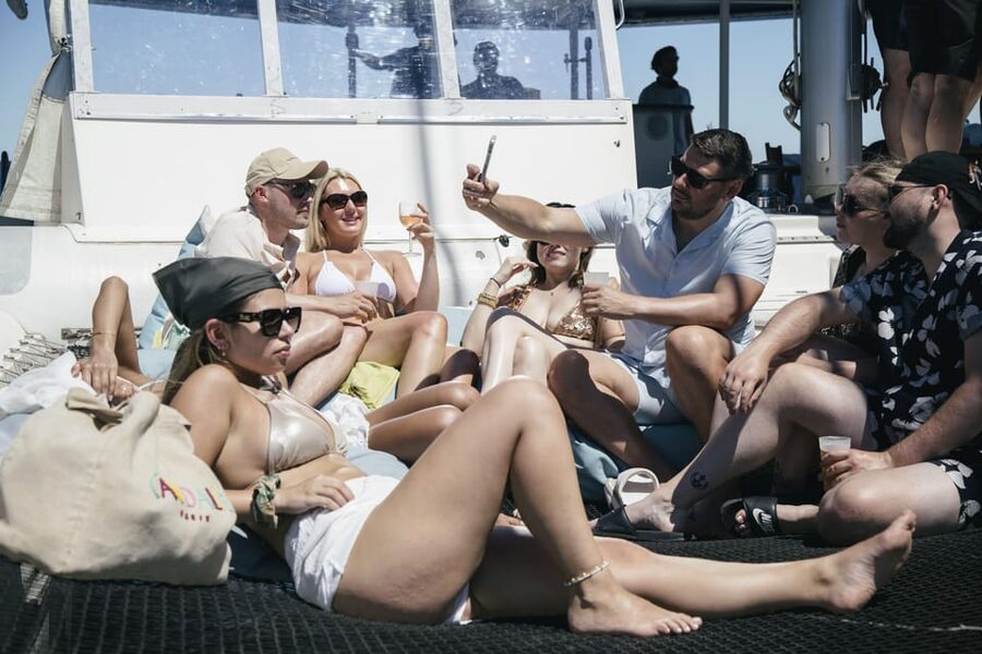 Lisbon: Catamaran Boat Party with Music, Open Bar & Dives - Music, song requests, and the kind of crowd vibe you’ll get