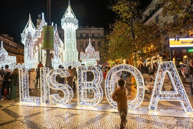 Lisbon Christmas Lights Tuk-Tuk Tour with Local Guide - Stop #1: Rossio Square and the Christmas Market mood