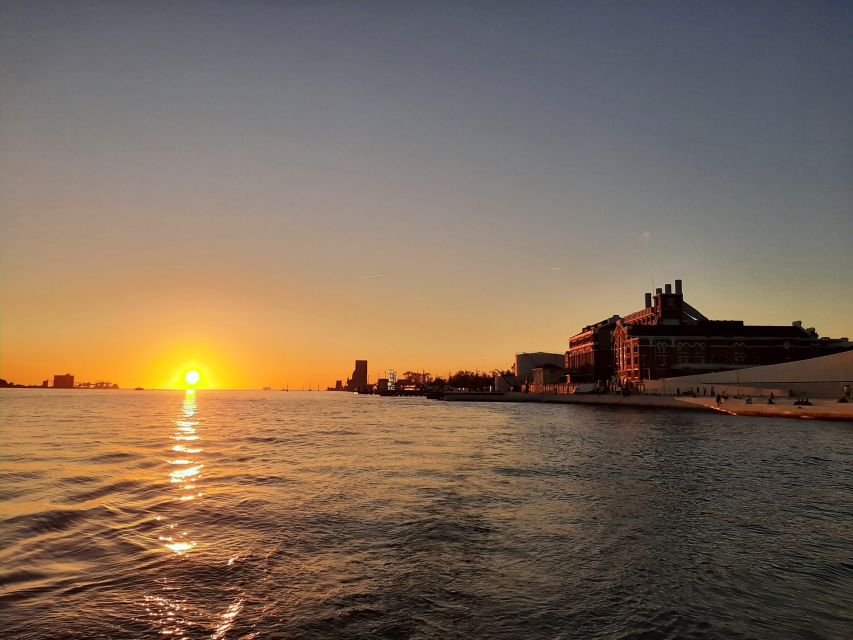 Lisbon: City Skyline Sailboat Cruise with Drink and Snacks - From Santo Amaro Dock: the easy start under the 25 de Abril Bridge