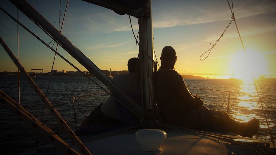 Lisbon: Enjoy a Sunset or Night Tagus River Sailboat Cruise - South bank sights: bridges, old forts, and Christ the King in the distance