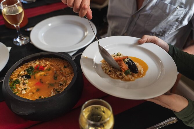 Lisbon Flavours: Baixa Guided Food Tour with Portuguese Wine - Rua da Vitória: grilled sardines, seafood rice, and a glass of Vinho Verde