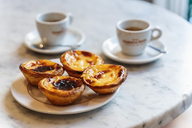Lisbon Flavours: Baixa Guided Food Tour with Portuguese Wine - Pastel de nata at Restauradores Square: dessert that lives up to the hype