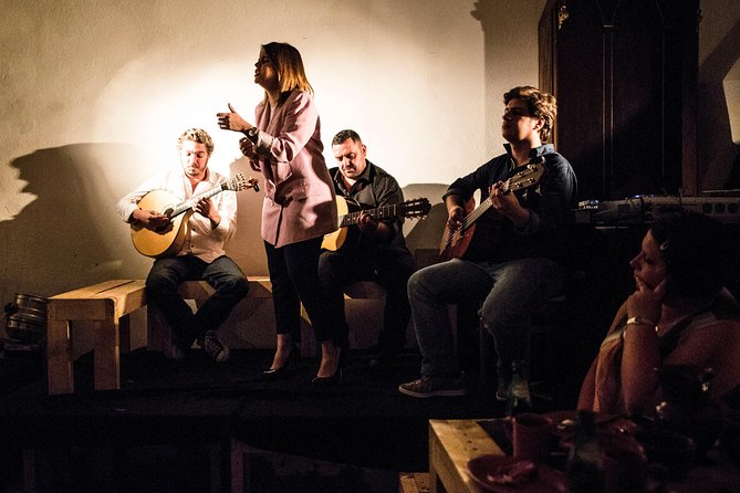 Lisbon Food Tour with 3 Stops and Fado Show Performance - What you actually eat: petiscos, classic dishes, and wine pairings