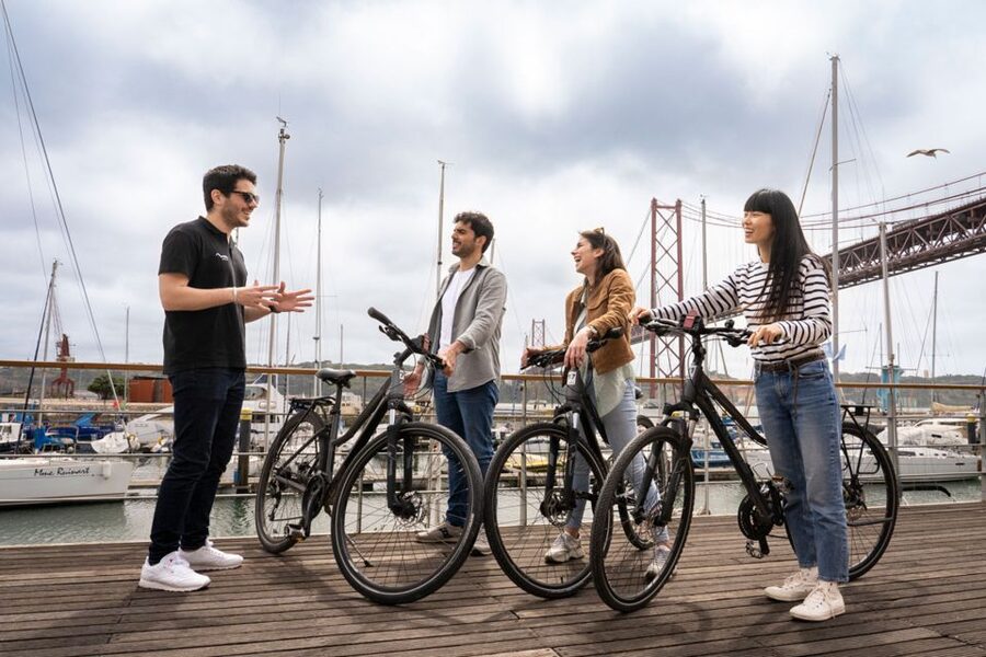 Lisbon: Guided Bike Tour, Helicopter Flight, and Boat Trip - Boat trip on the Tagus: cruising past the 25th of April Bridge