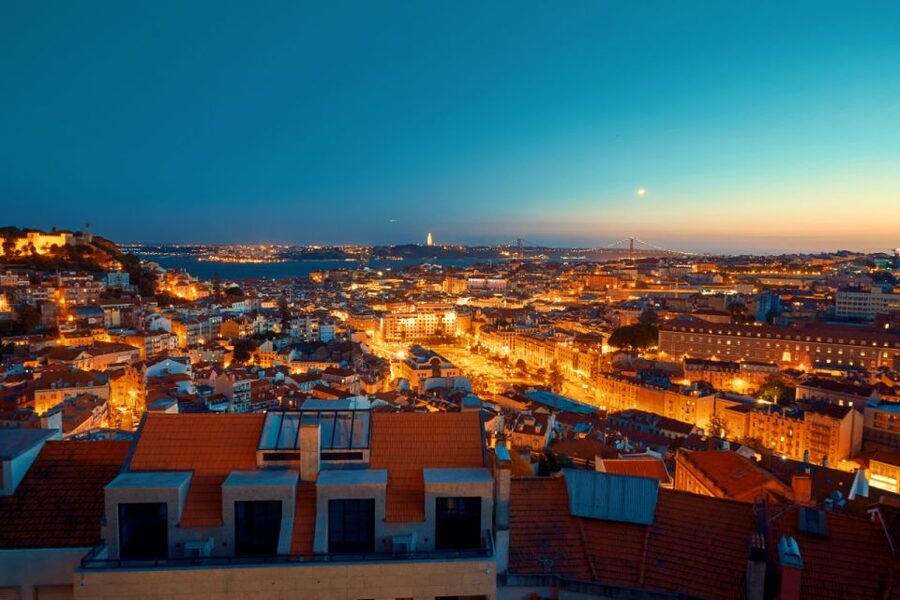 Lisbon: Luxury Fado Tour with Dinner included - Lisbon after dark, with the lights doing the work