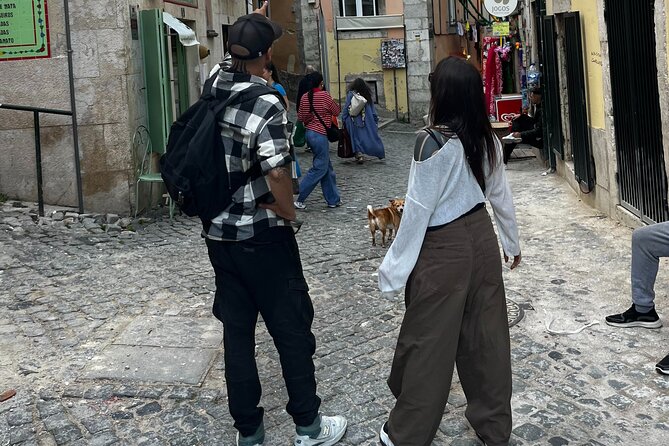 Lisbon on TukTuk - Alfama in motion: steep streets, shops, and the Miradouro angle