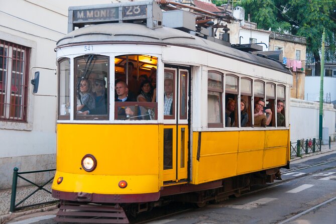 Lisbon Private Family Tour Castle Visit , Local Tastings & Games - Santa Justa and Chiado’s tiled streets: where the day stays playful