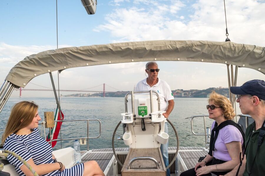 Lisbon: Private Sunset Cruise on the Tagus River with Drink - Almada at Golden Hour: Cristo-Rei’s Outstretched Arms