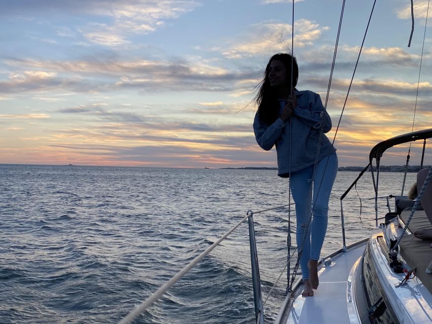 Lisbon: Private Tagus River Sunset Cruise on a Luxury Boat - Passing the 25 de Abril Bridge and heading toward Lisbon’s hills