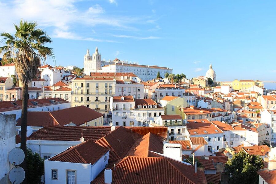 Lisbon: Private Tour by Tuk Tuk - Alfama on purpose: fado, earthquake survivors, and June festival energy