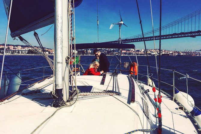 Lisbon Sailing Day Cruise with wine & snacks - Wine, snacks, and the feel of a small-boat evening