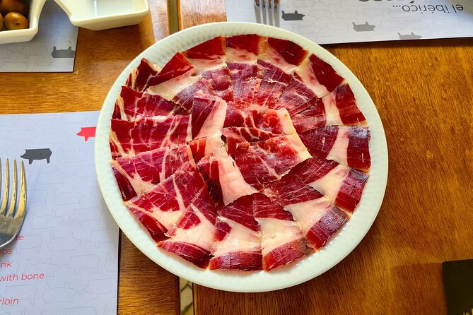 Lisbon Small-Group Food Tour: Eat & Drink Like a Local - Chouriço assado and bold red wine: smoky, rustic comfort