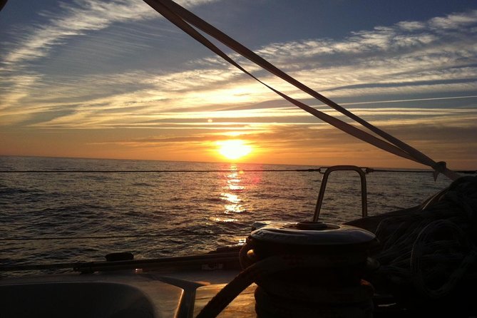 Lisbon Small Group Sunset Sailing 2h Cruise with Drinks Included - 25 de Abril Bridge and the two-bridge view