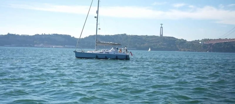 Lisbon Sunset Boat Tour Wine included - The skipper and co-skipper: small-group narration that makes stops click