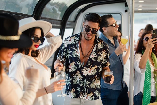 Lisbon: Sunset DJ & Porto Tonic Premium Boat Experience - First big sights: 25 de Abril Bridge and the river’s best angle