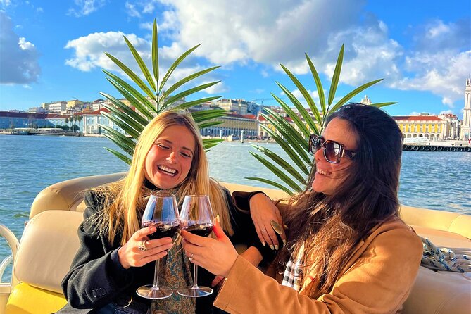 Lisbon Sunset Experience: Cruise, Wine and Live Music by the Capt - MAAT, the 25 de Abril Bridge, and Praça do Comércio from deck level