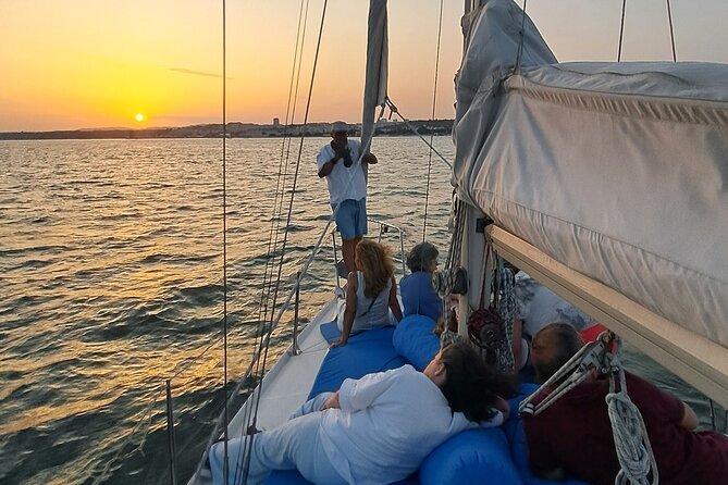 Lisbon: Sunset Sailboat Tour on the Tagus River + Welcome Drink - Welcome Drink and Snacks: Simple, Included Comfort