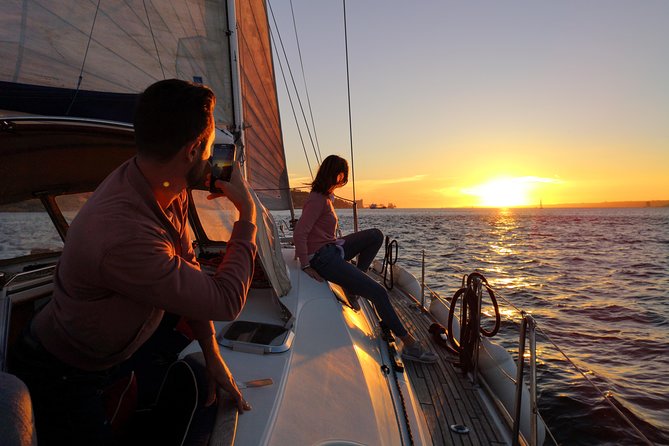 Lisbon Sunset Sailing Tour on Luxury Sailing Yacht with 2 Drinks - The halfway moment: two drinks and Portuguese cheese & chouriço