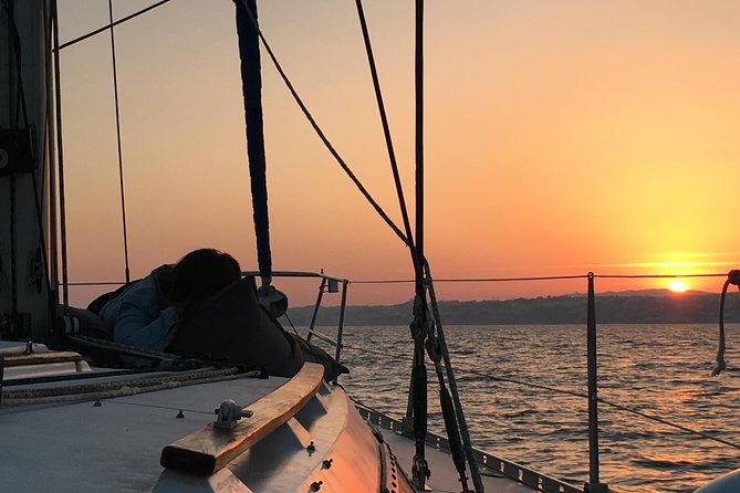 Lisbon Sunset Sensations on a Private Sailing Boat with wine&snacks - A private 2-hour sunset sail from Doca Alcântara