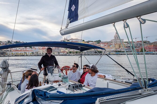 Lisbon: Sunset Tagus River Sailing Tour with Drinks - The part you feel most: crew energy, blankets, and what you sip