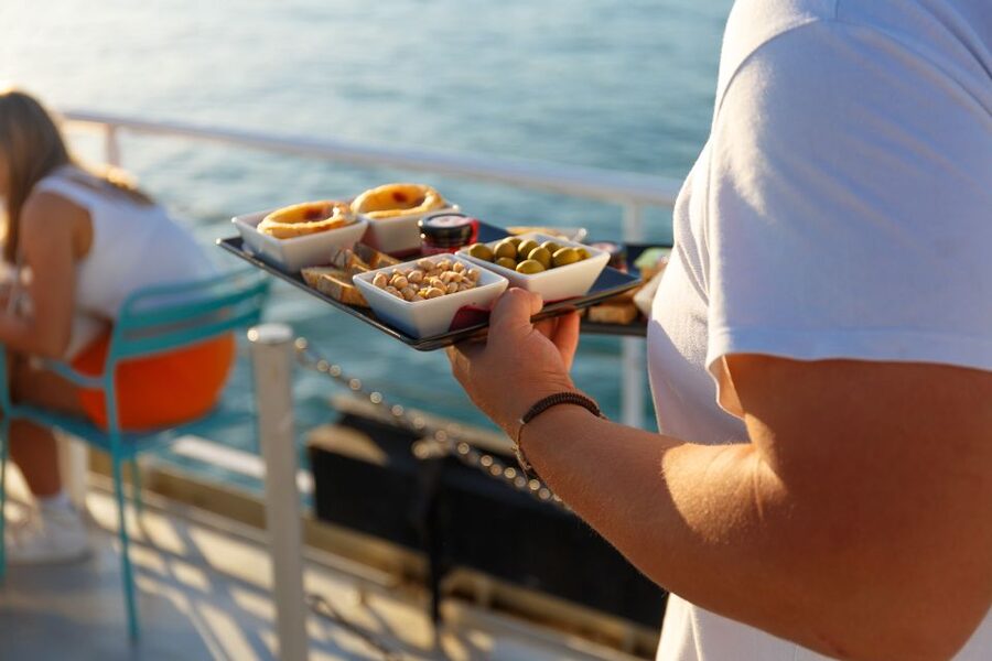Lisbon: Tagus River Sunset Tour with Snacks and Drink - Sundeck seats, cold wind, and how to pick your spot