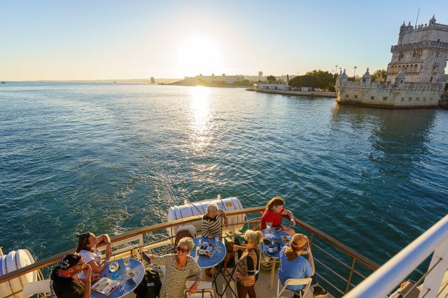 Lisbon: Tagus River Sunset Tour with Snacks and Drink - Commerce Square from the water: where the river view begins