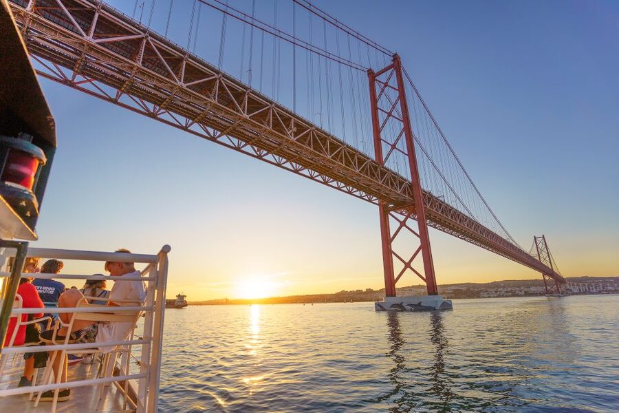 Lisbon: Tagus River Sunset Tour with Snacks and Drink - 25 de Abril Bridge: the closest Lisbon will feel to you