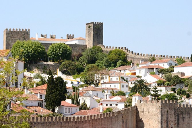 Lisbon to Porto Up To 5 Stops Óbidos Nazaré Fátima Coimbra Aveiro - Price and logistics: is it worth $604.08 per person?