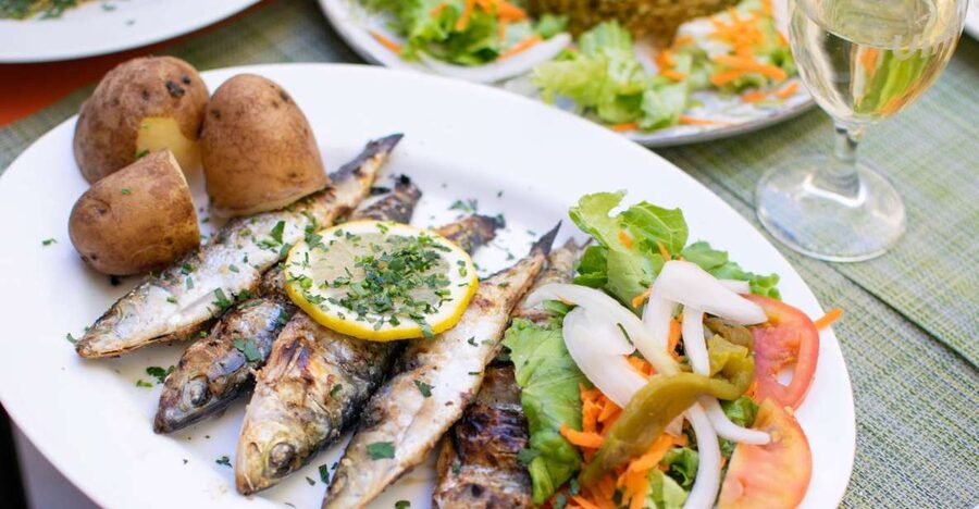 Lisbon Traditional Portuguese Food and Sightseeing Tour - The first restaurant stop: tasting traditional dishes with story context