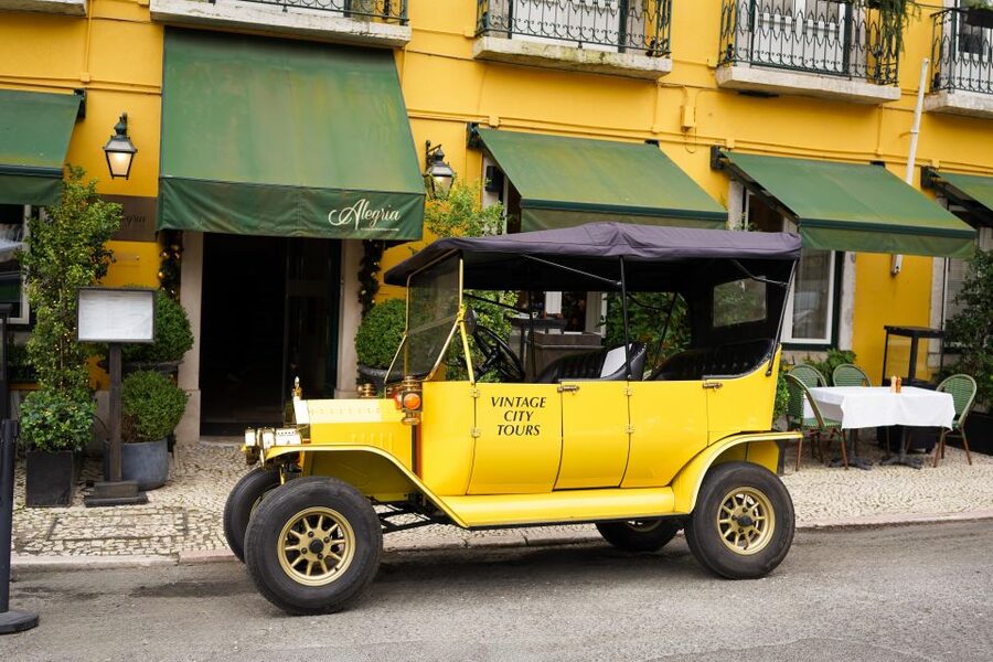 Lisbon: Tuk Tuk City tour with vintage car - Baixa de Lisboa: squares, grand architecture, and the city’s core feel