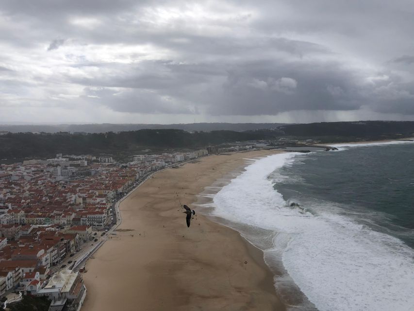 Nazaré: Big Wave Capital & Medieval Óbidos tour from Lisbon - Nazaré: when the Canyon turns ocean swell into legend