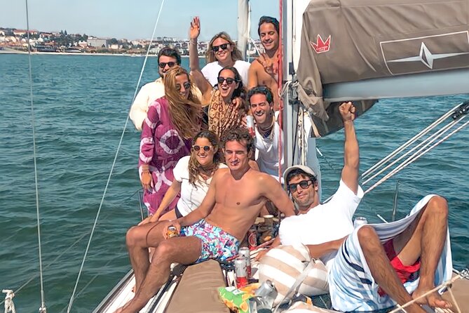 Private Beach Tour on a Luxury Sailing Boat in Lisbon - Paço de Arcos and Praia Nova: wide sand, rocks, and a classic coastal feel