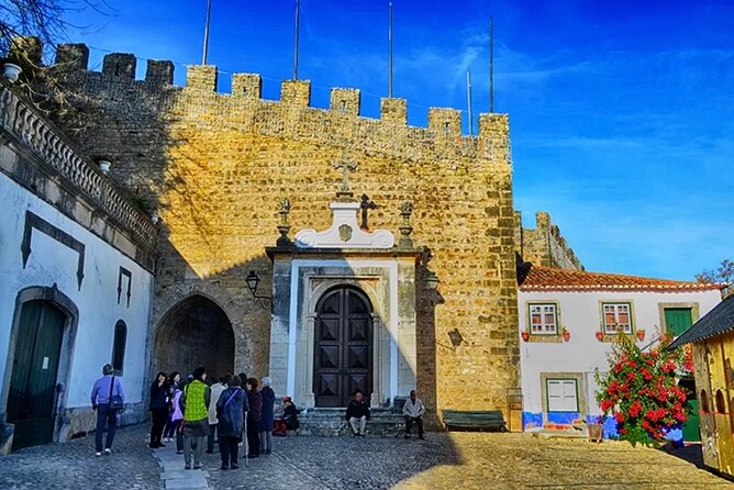 Private Lisbon to Fátima, Nazaré & Óbidos Tour – Spirit & Charm - Óbidos: medieval lanes, walls, and a castle with layered power